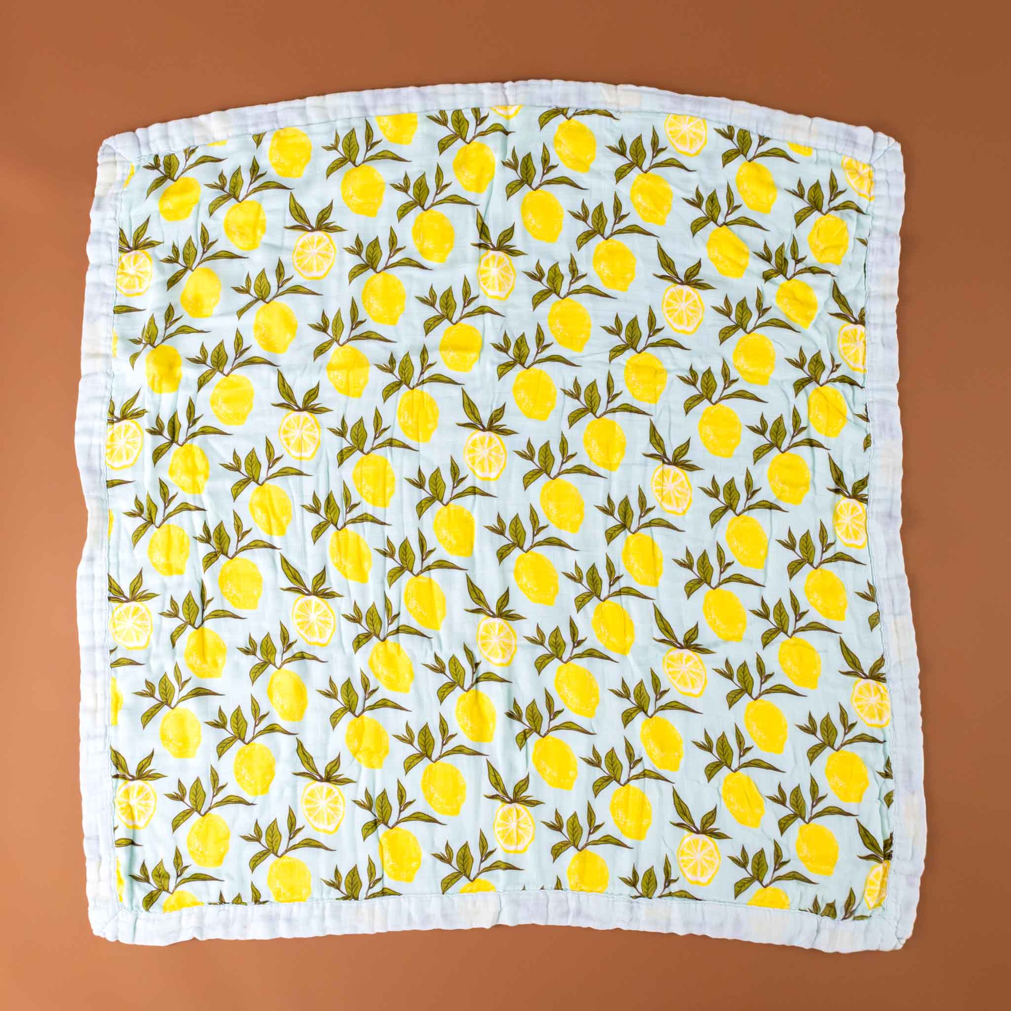 big-lovie-lemons-blanket-with-yellow-lemons-and-green-leafs-on-a-light-blue-background-square