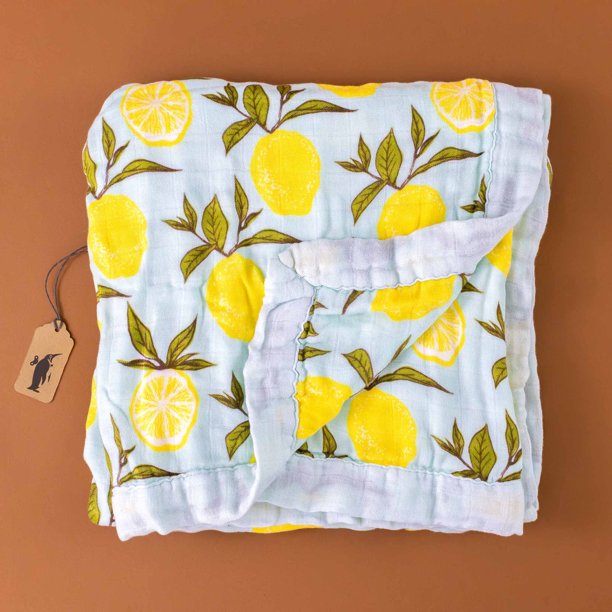 big-lovie-lemons-blanket-with-yellow-lemons-and-green-leafs-on-a-light-blue-background