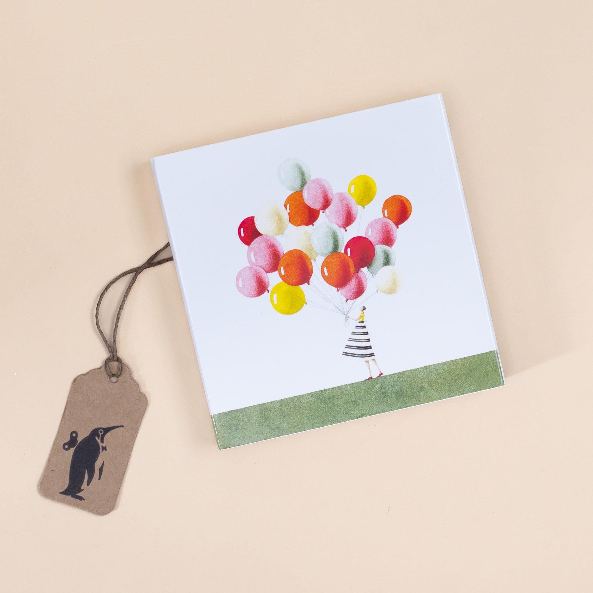 box-full-of-matches-balloon-bunch-held-by-women-in-striped-dress