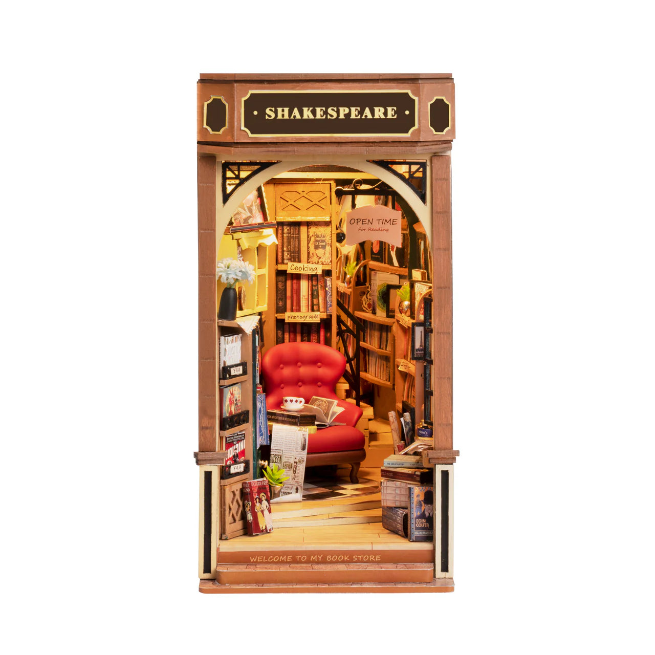 build-your-own-wooden-book-nook-petite-book-shoppe-finished-design-with-chair-surrounded-by-books-and-shakespeare-sign