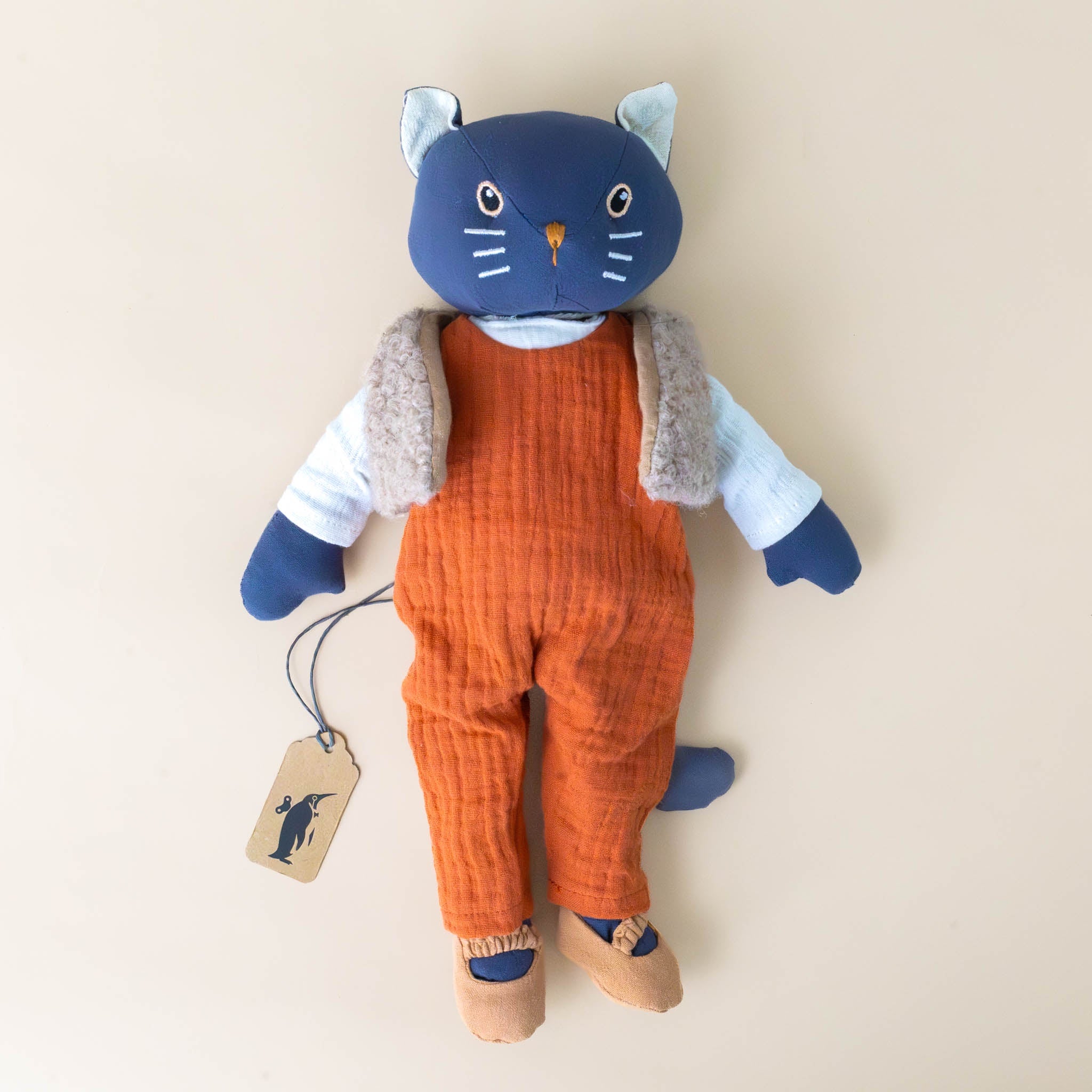 cesar-the-blue-cat-with-cream-shirt-tan-vest-brown-shoes-and-orange-overalls