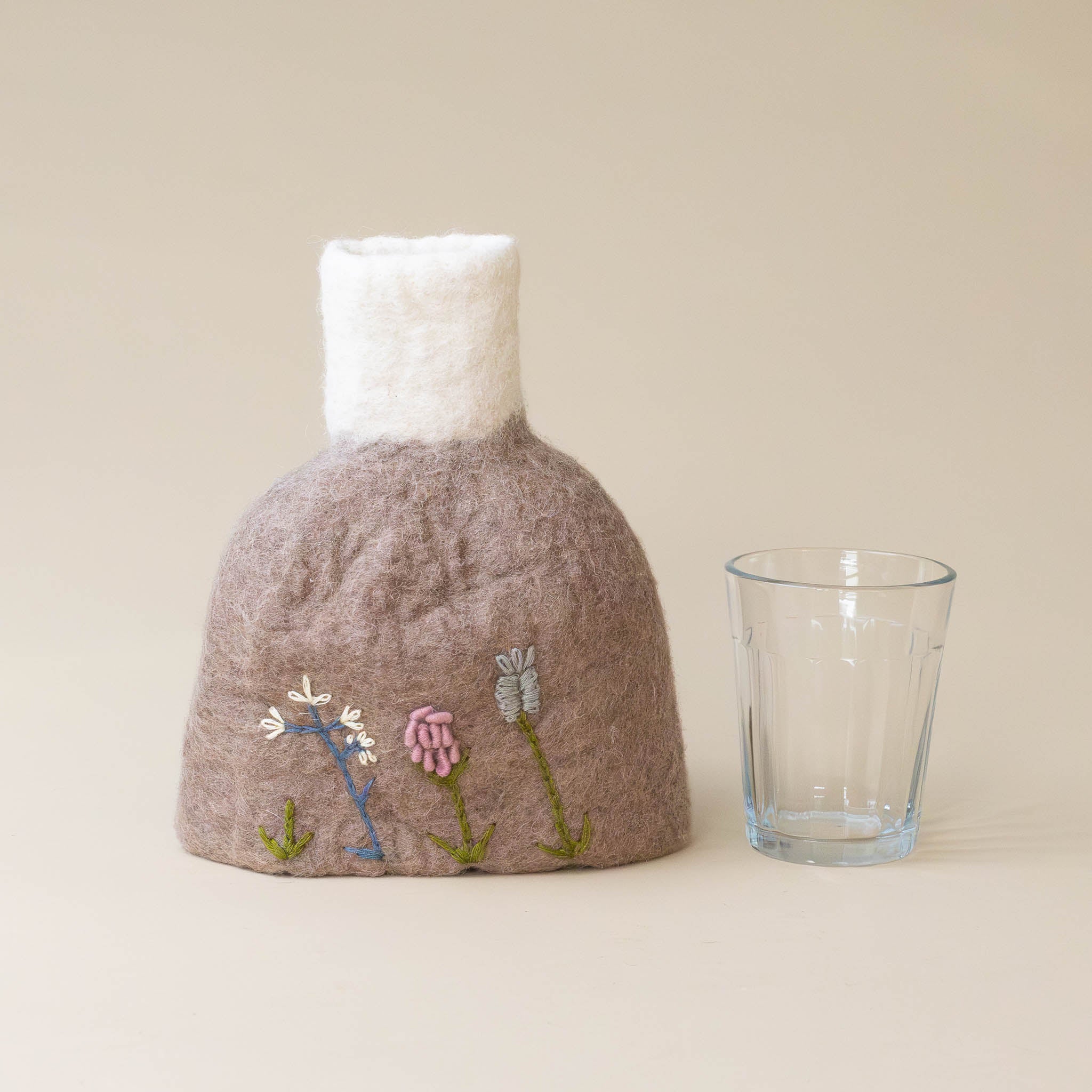 felt-vase-dusty-mauve-with-wildflower-embroidery-and-glass-for-scale