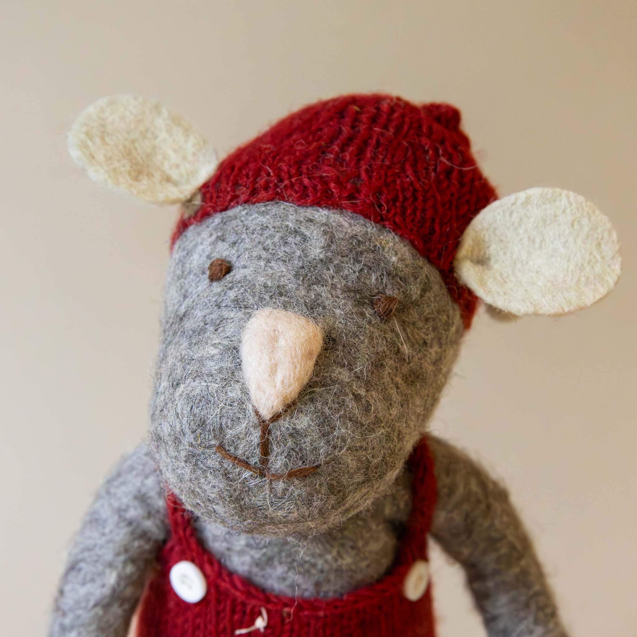 felted-grey-mouse-face-with-blush-nose-and-cream-ears-topped-with-red-hat