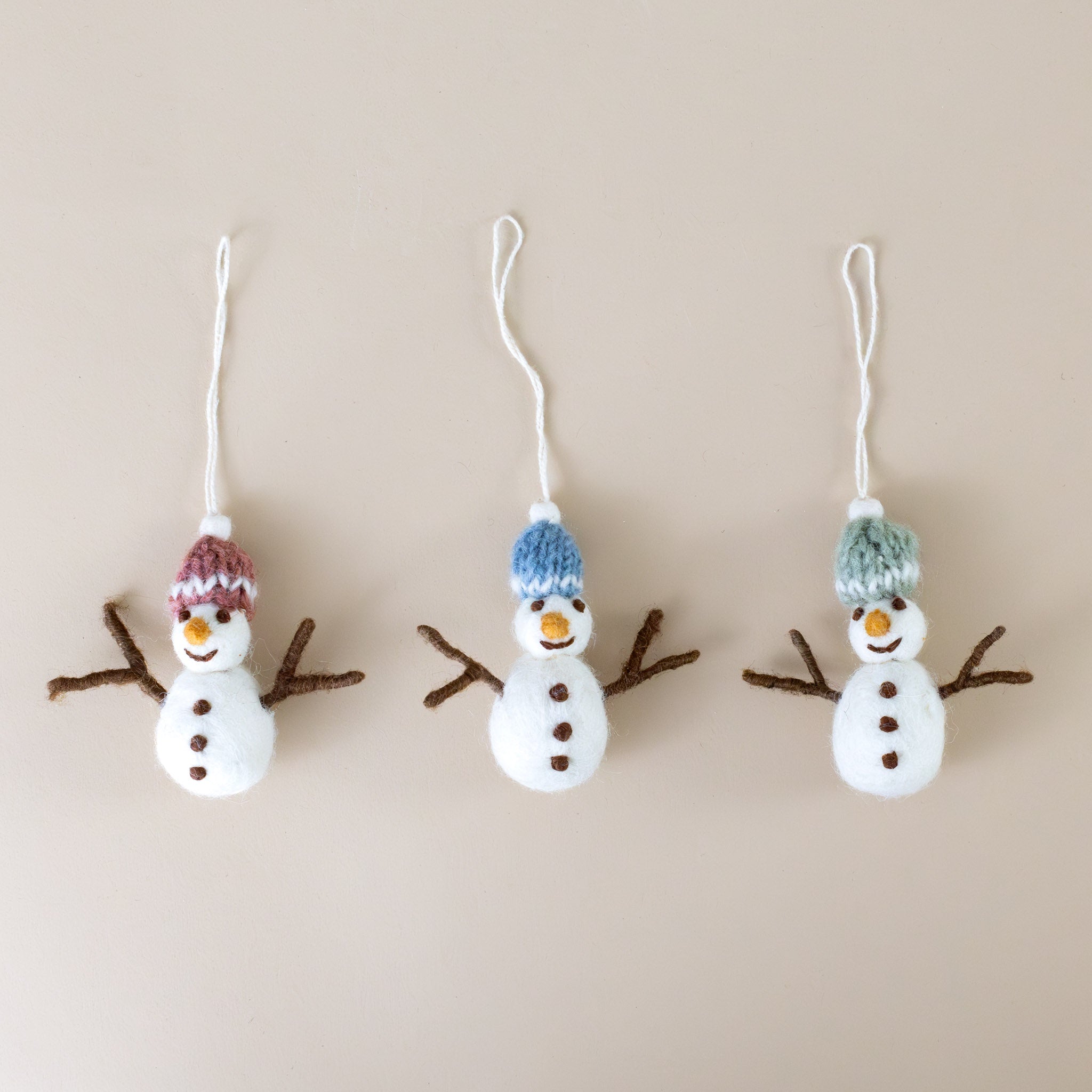 felted-snowman-with-knit-hats-ornament-trio-pink-blue-green-hats