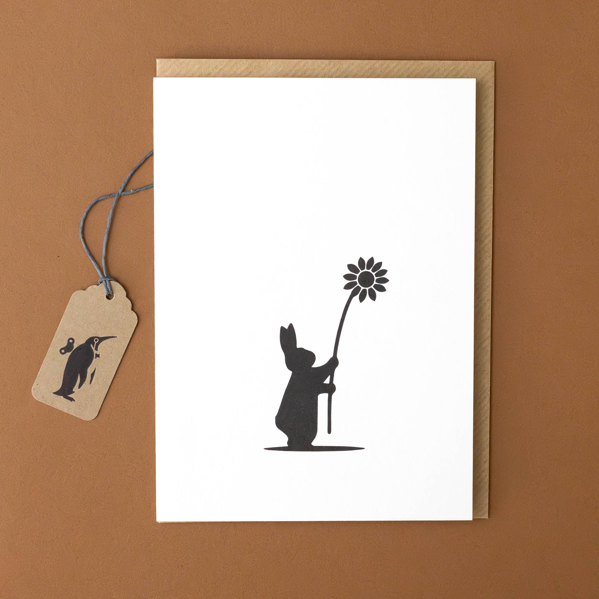 black-and-white-flower-giving-rabbit-greeting-card-with-kraft-envelope