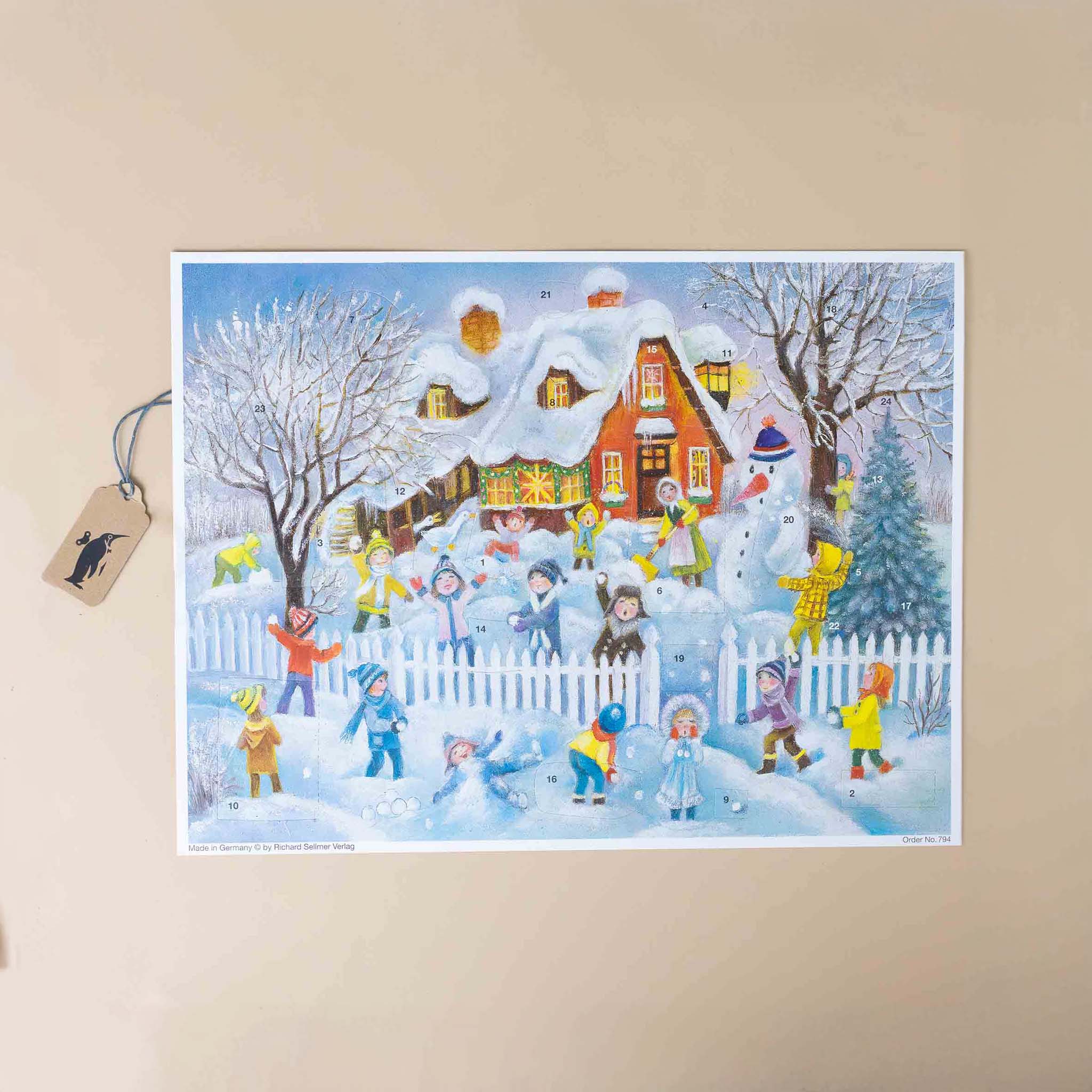 german-advent-calendar-snowball-fight-with-children-colorfully-dressed-in-front-of-a-home-that-looks-like-a-gingerbread-house