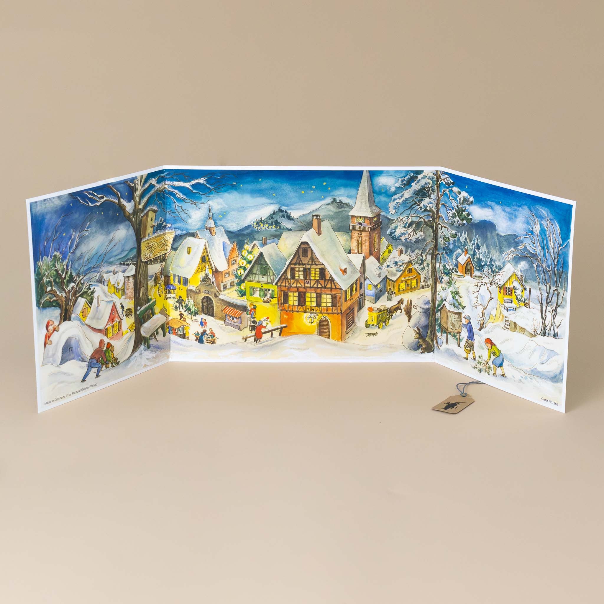 german-advent-calendar-winter-village-warmly-lit-buildings-with-snow-capped-roofs-and-people-busy-playing-and-working-in-town