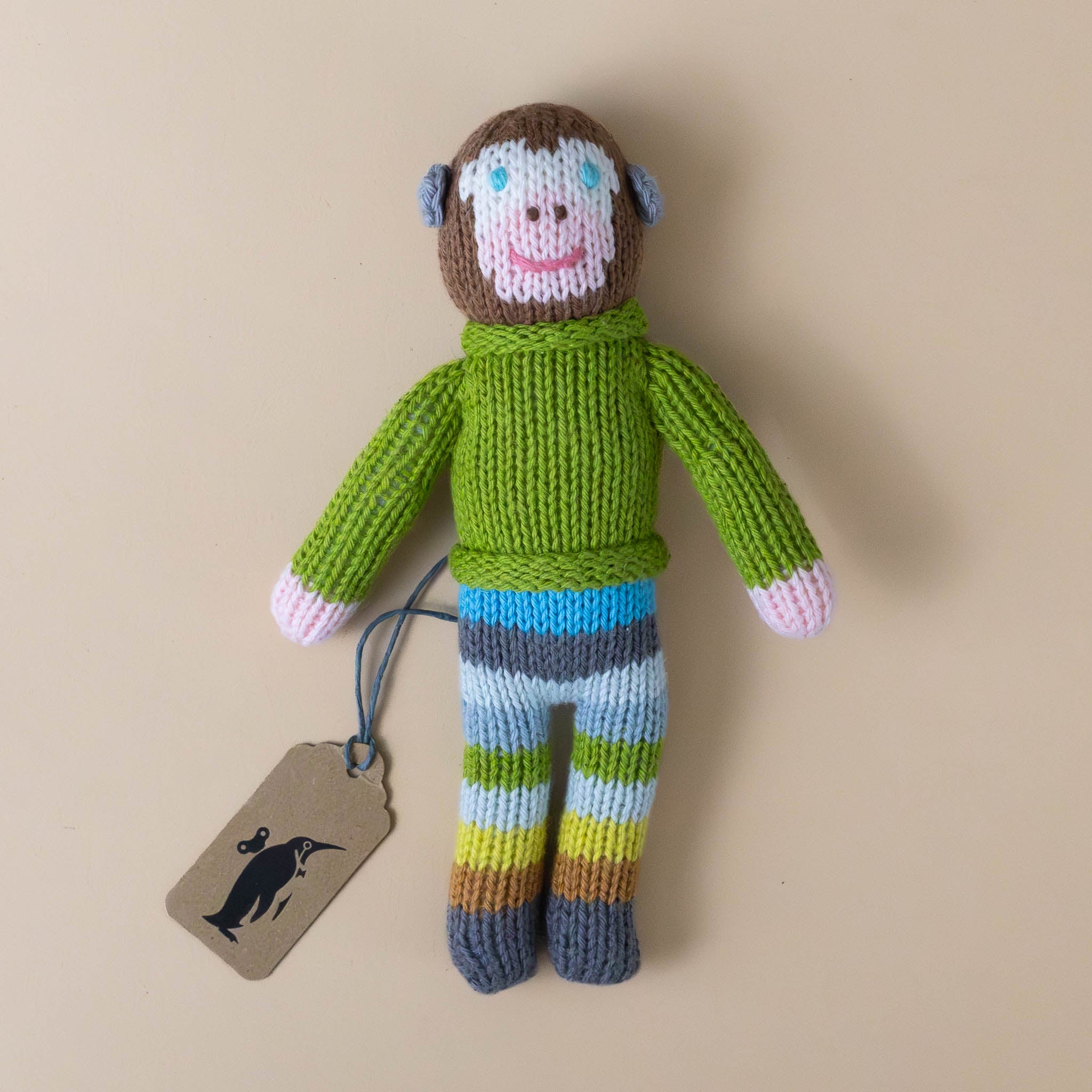 hand-knit-rattle-pierre-monkey-with-green-sweater-and-striped-blue-green-and-brown-pants