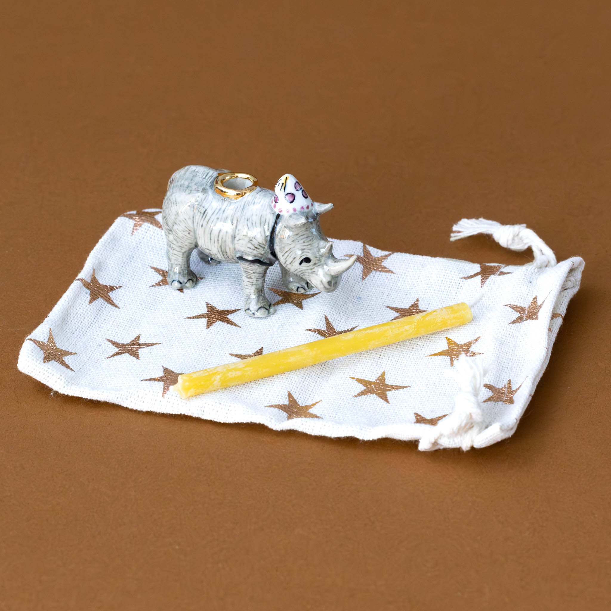 heirloom-porcelain-cake-topper-rhinoceros-with-storage-bag-and-candle