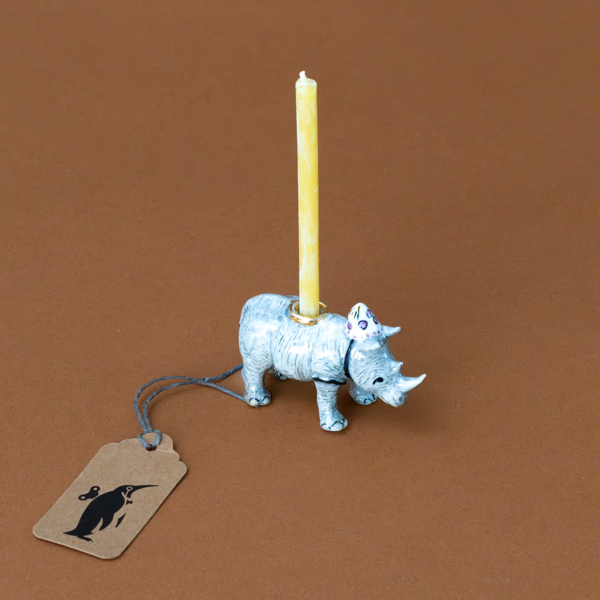 heirloom-porcelain-cake-topper-rhinoceros-with-candle