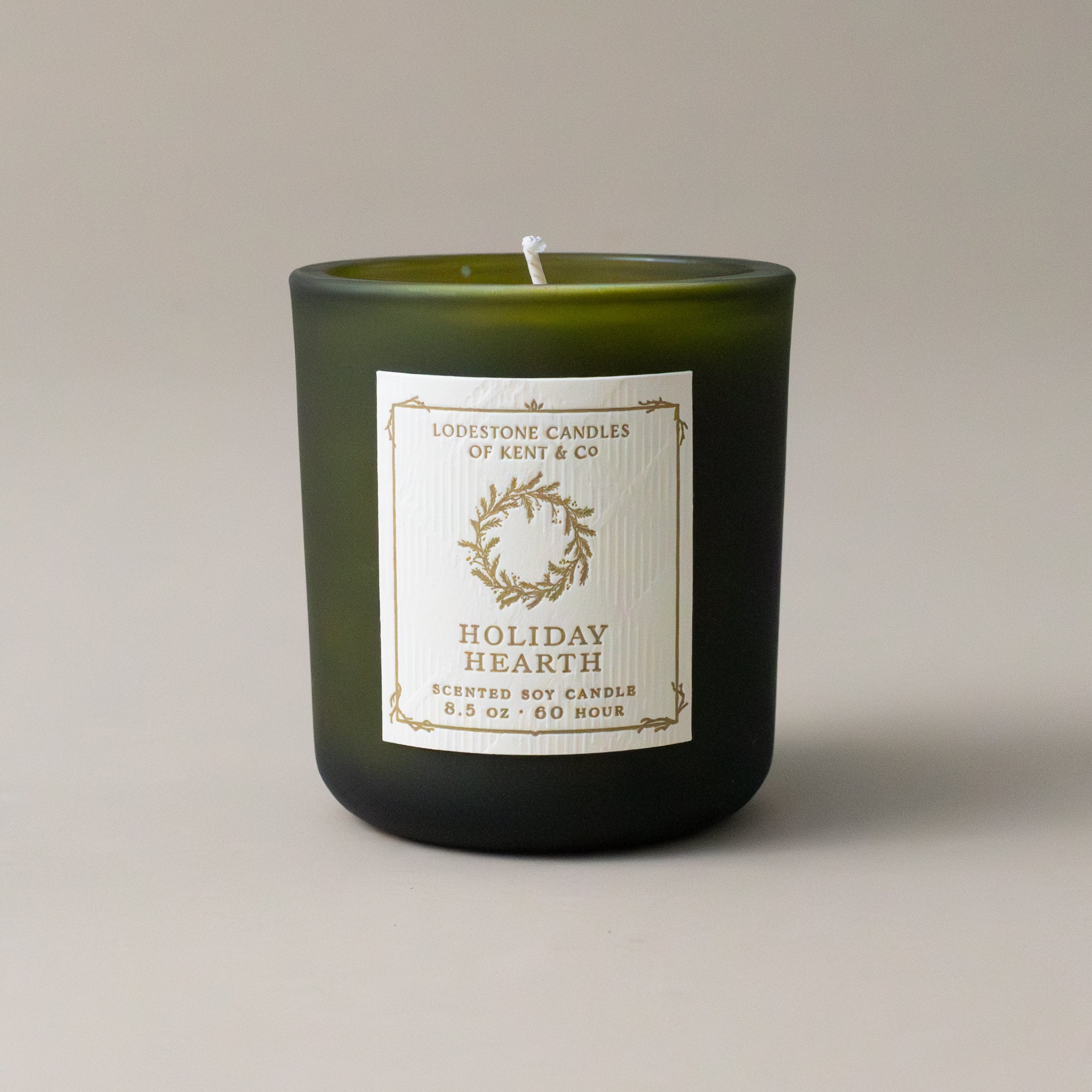 white-soy-holiday-hearth-candle-in-green-glass-jar