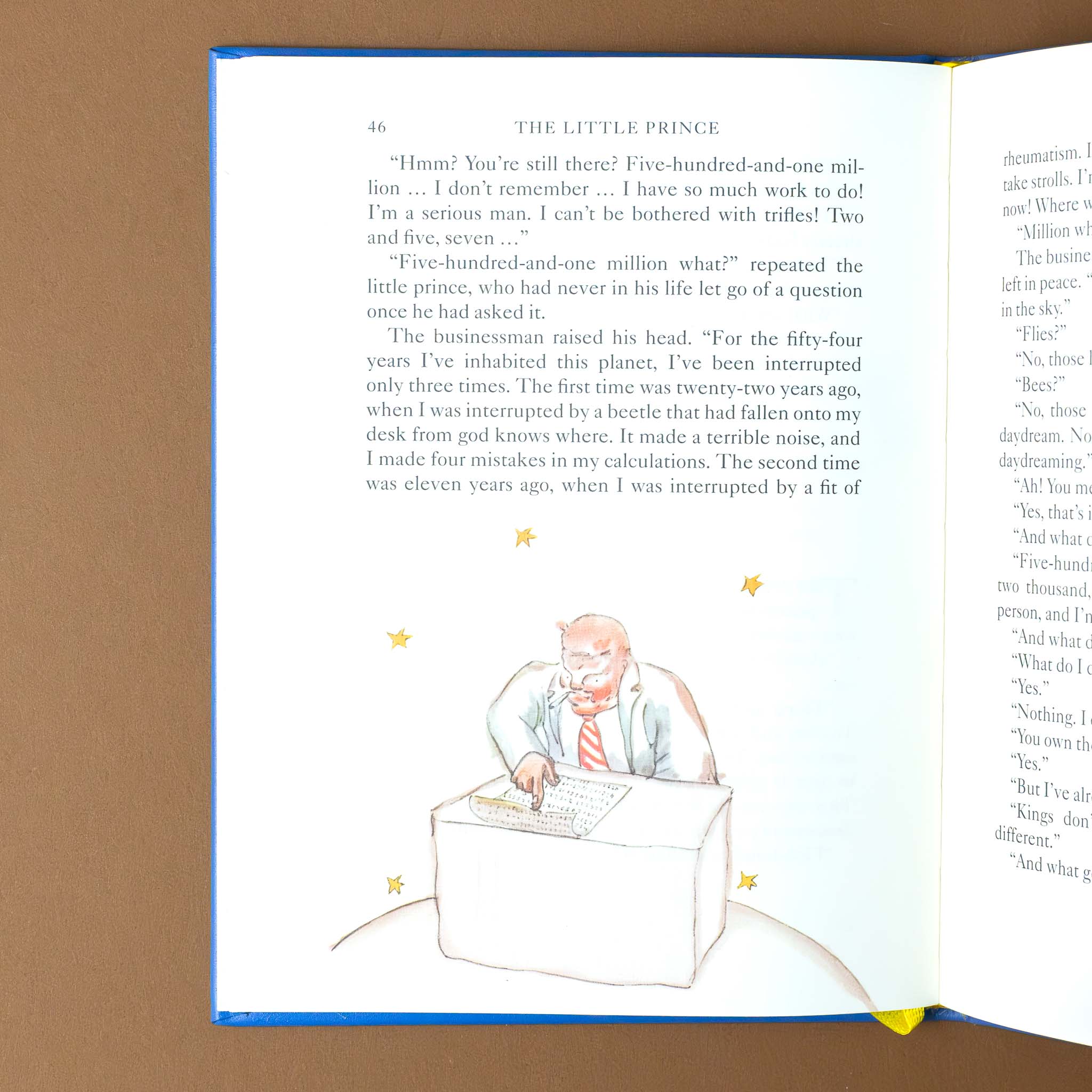 leather-bound-the-little-prince-book-interior-page-with-a-man-at-a-desk-with-text