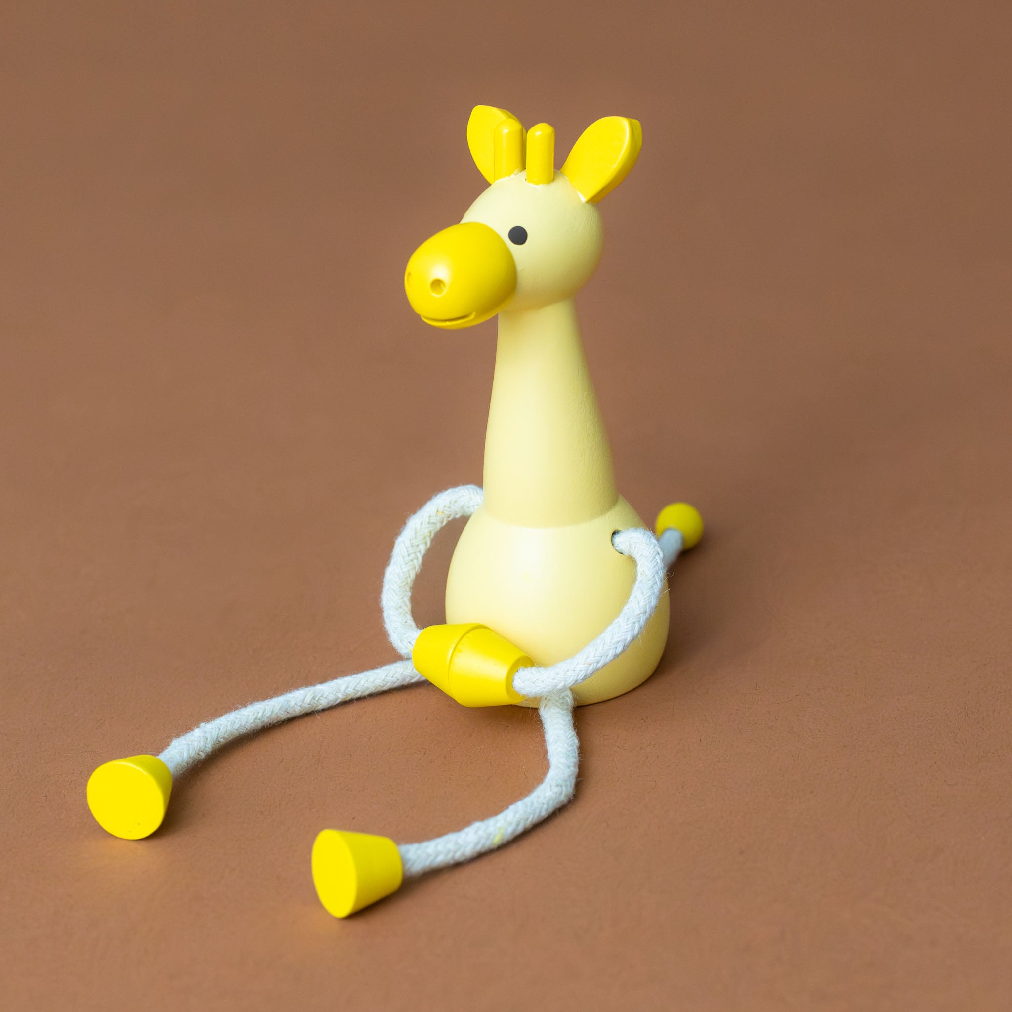 little-palimal-friend-yellow-giraffe-sitting-with-arms-connected-and-legs-outstretched