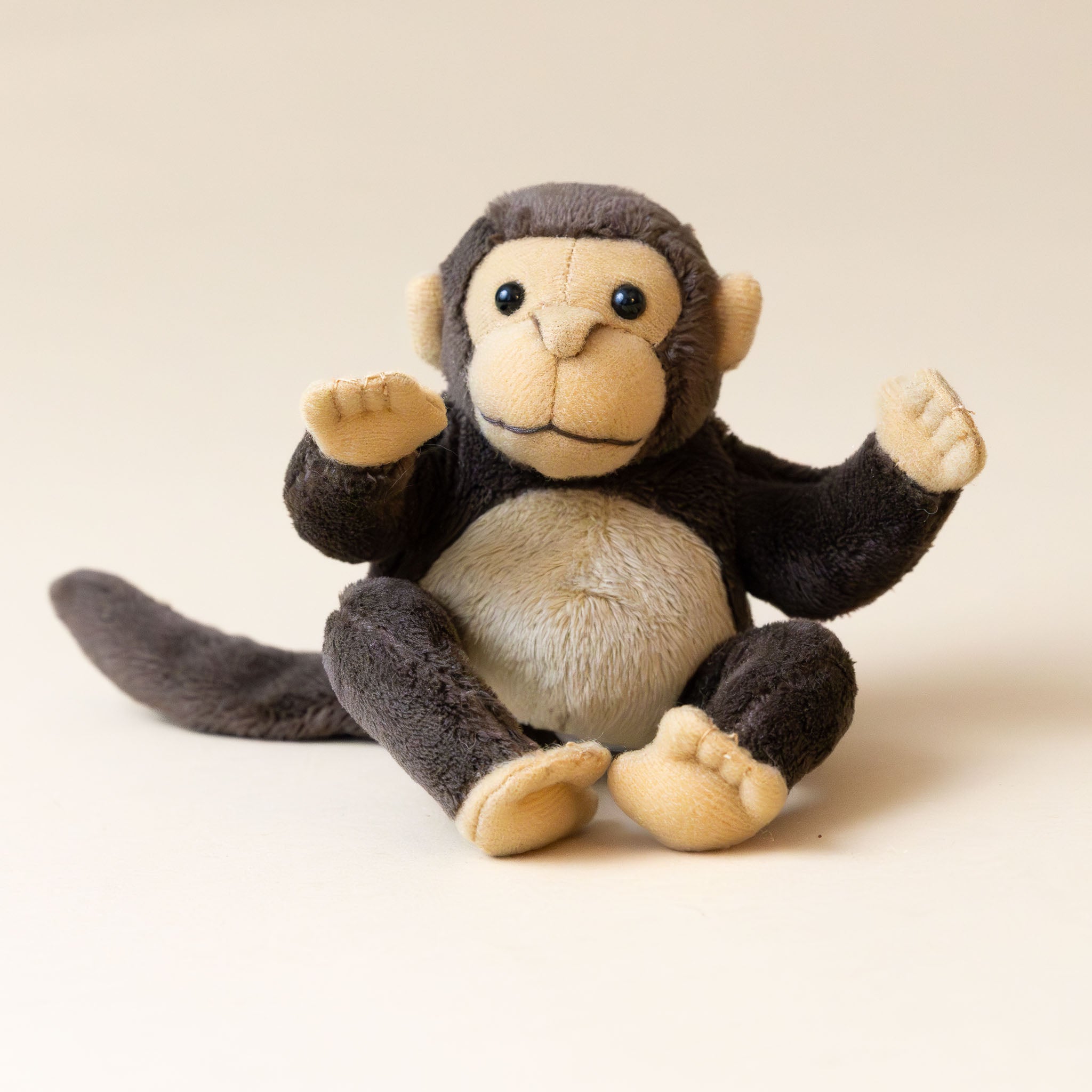 brown-and-tan-merlin-monkey-finger-puppet-sitting