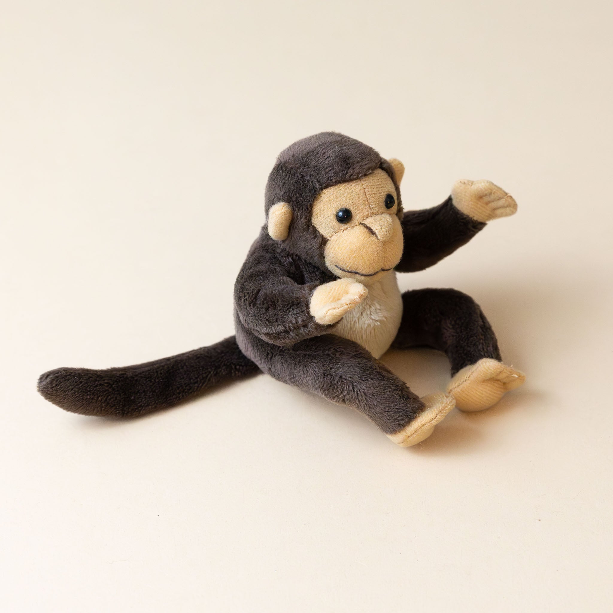 brown-and-tan-merlin-monkey-finger-puppet-side-and-tail