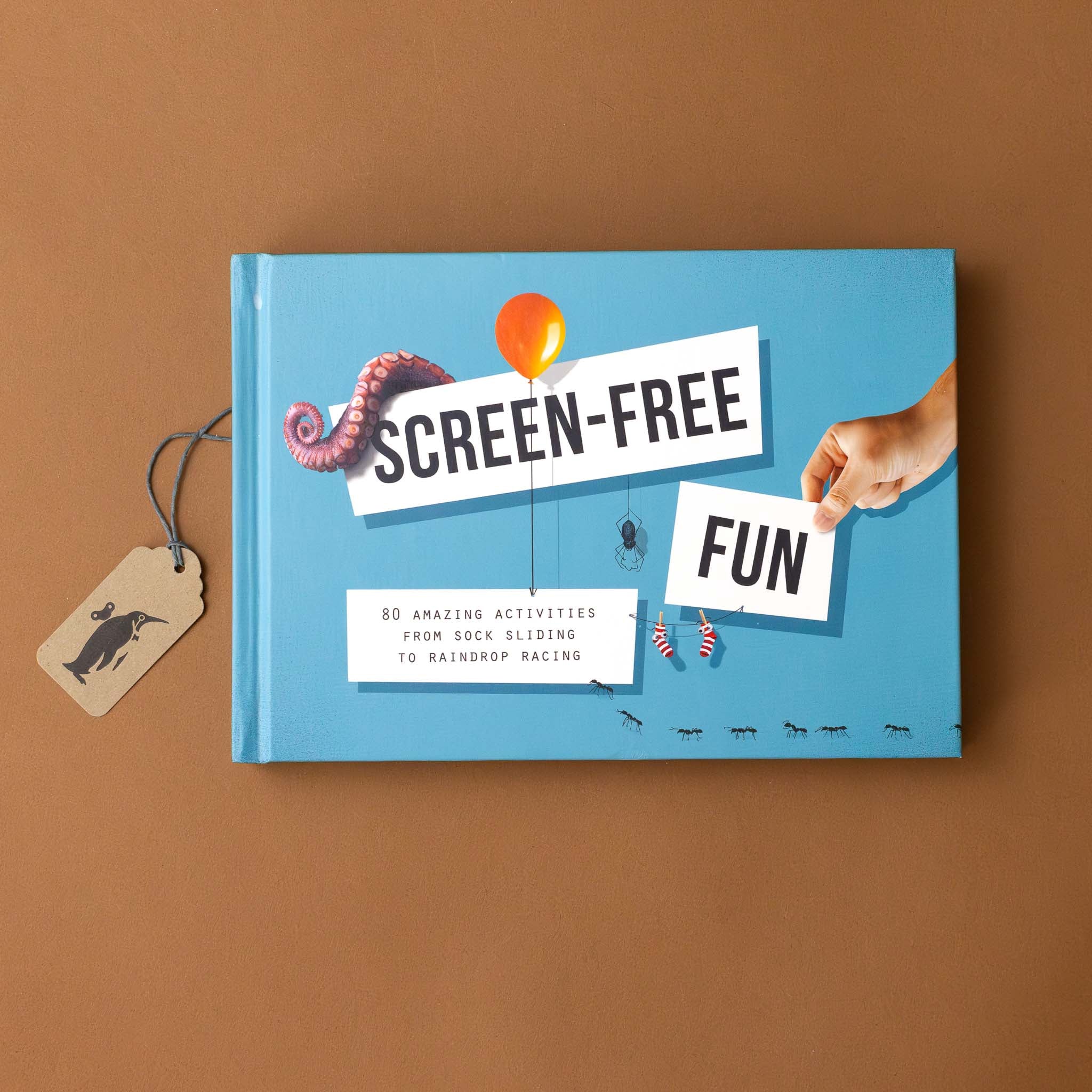 screen-free-fun-offline-activity-book-blue-cover-with-hung-stockings-balloon-leg-with-tentacles-and-a-spider