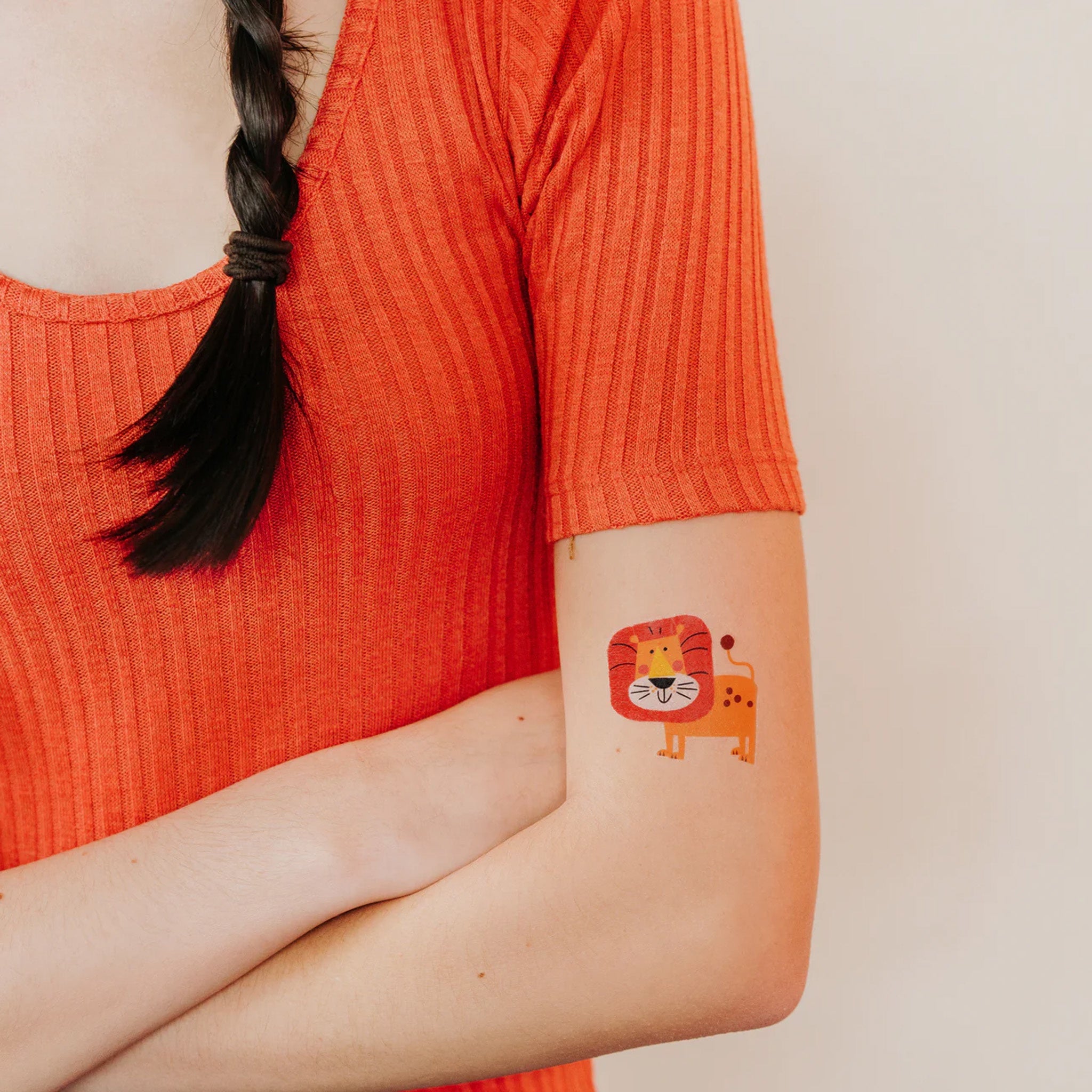 tattly_ed-miller_leo-lion_temporary-tattoo-orange-yellow-and-black