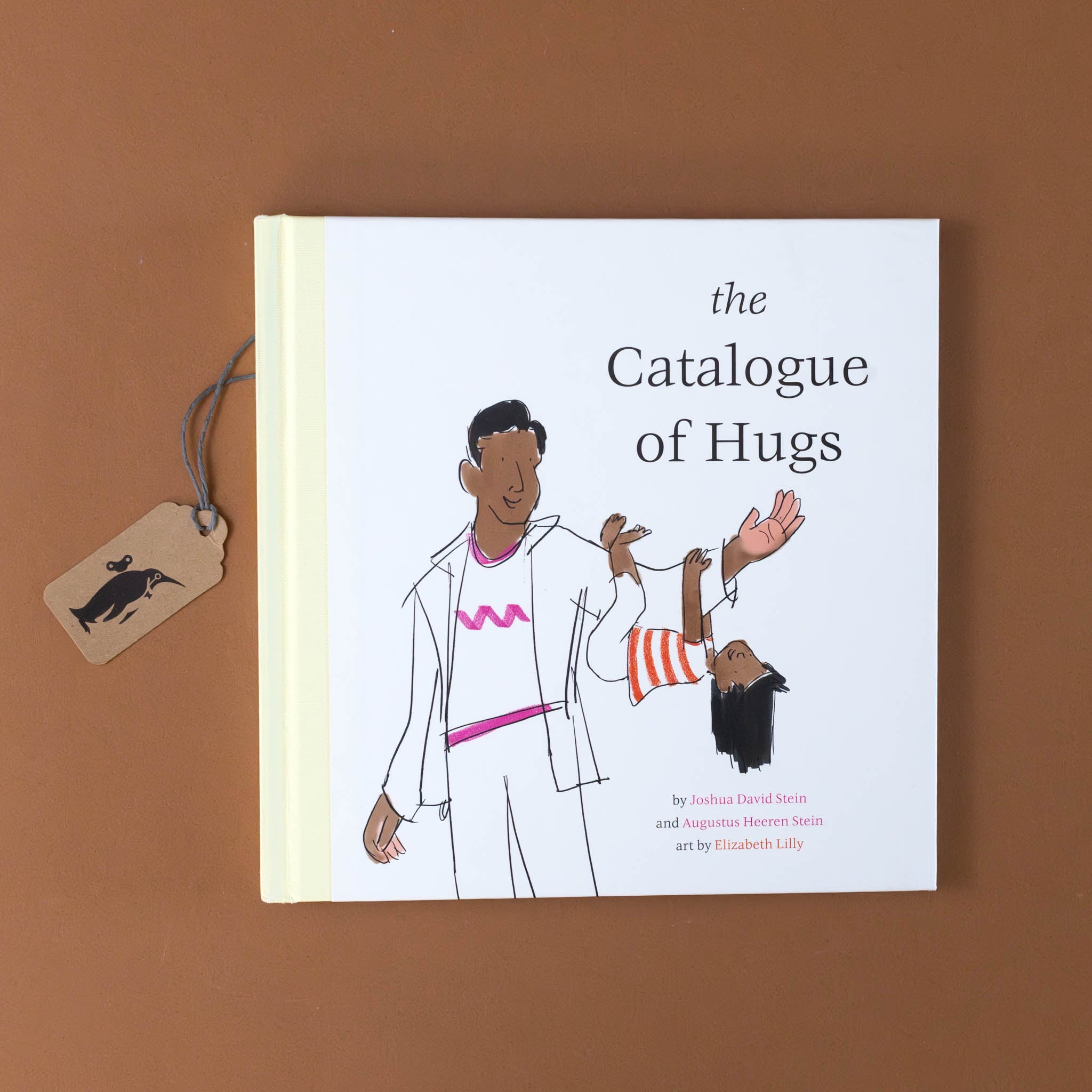 the-catalogue-of-hugs-book-cover-with-a-child-hugging-their-dads-arm