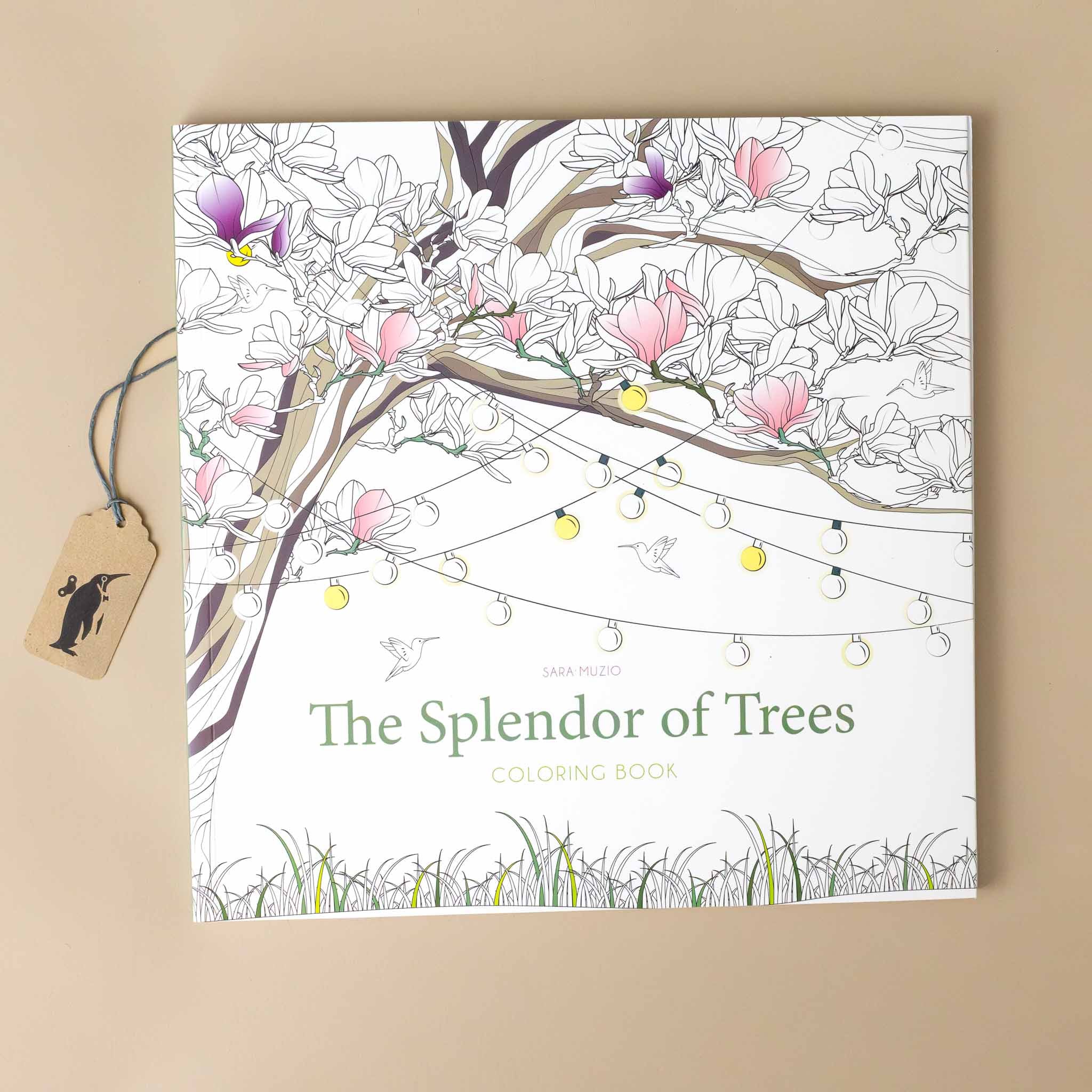 the-splendor-of-trees-coloring-book-cover-with-a-magnolia-tree-blossoming-and-covered-in-strings-of-lights