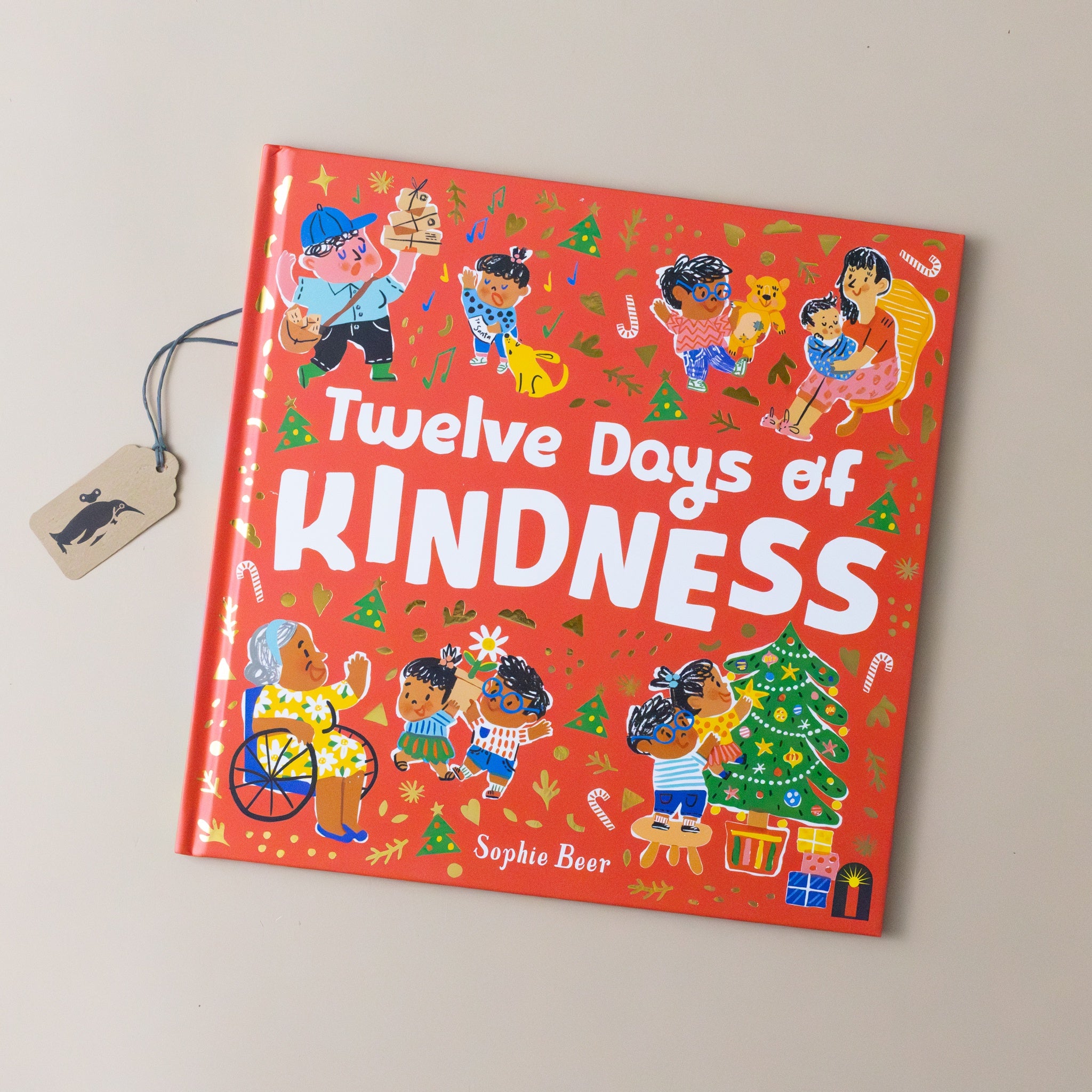 the-twelve-days-of-kindness-book-red-cover-with-people-decorating-christmas-trees-giving-gifts-and-making-snowflakes