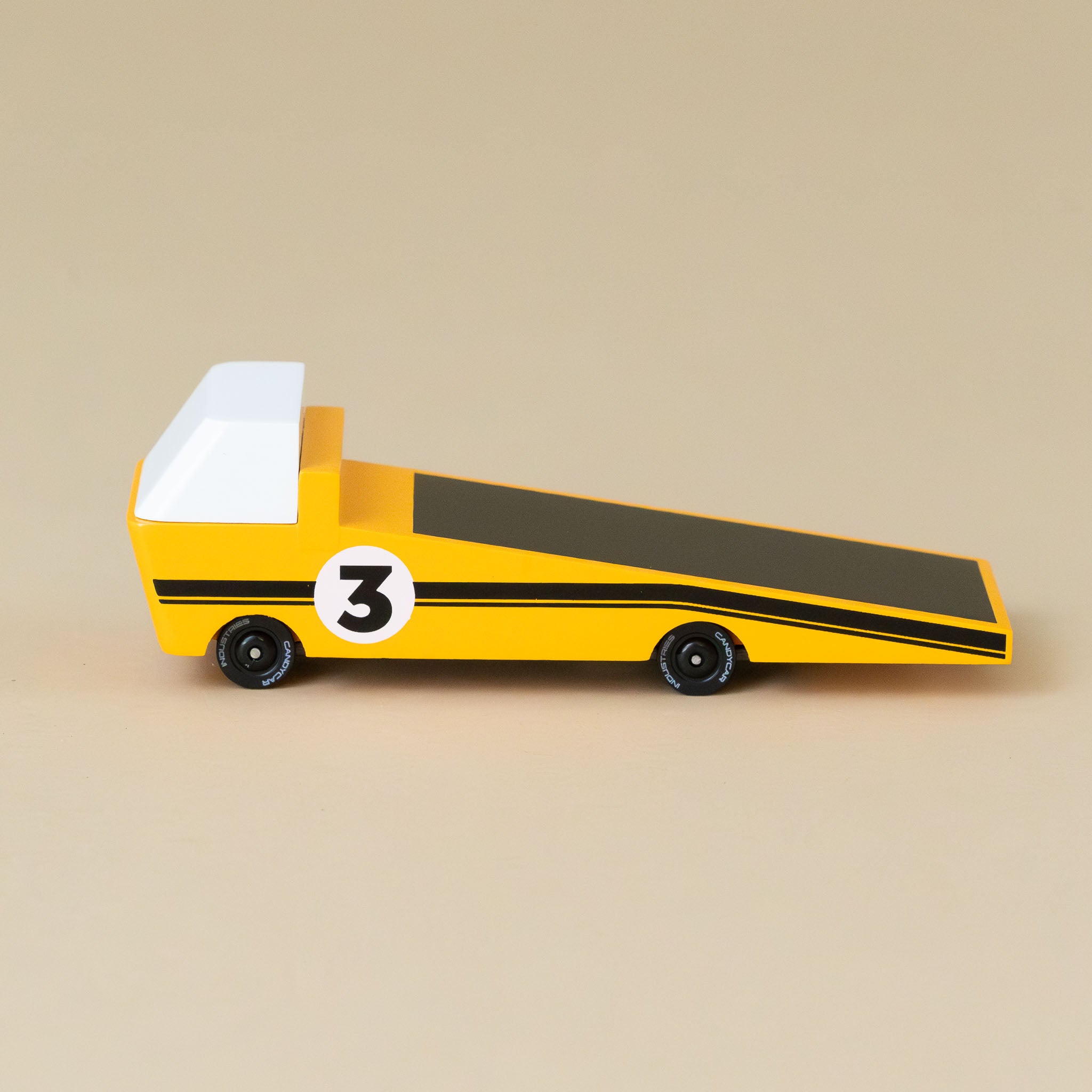 yellow-wooden-candyvan-racer-tow-truck-with-white-cab-black-stripes-and-number-3-emblem