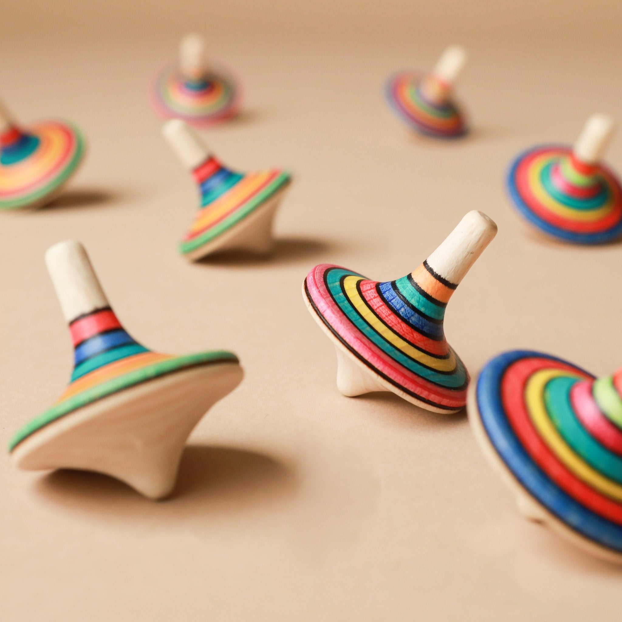 colorful-striped-wooden-spinning-tops