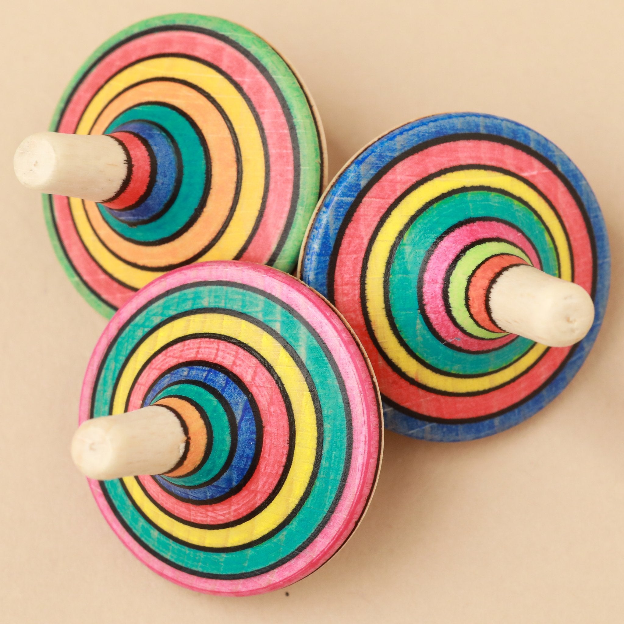 three-spinning-tops-shown-from-above