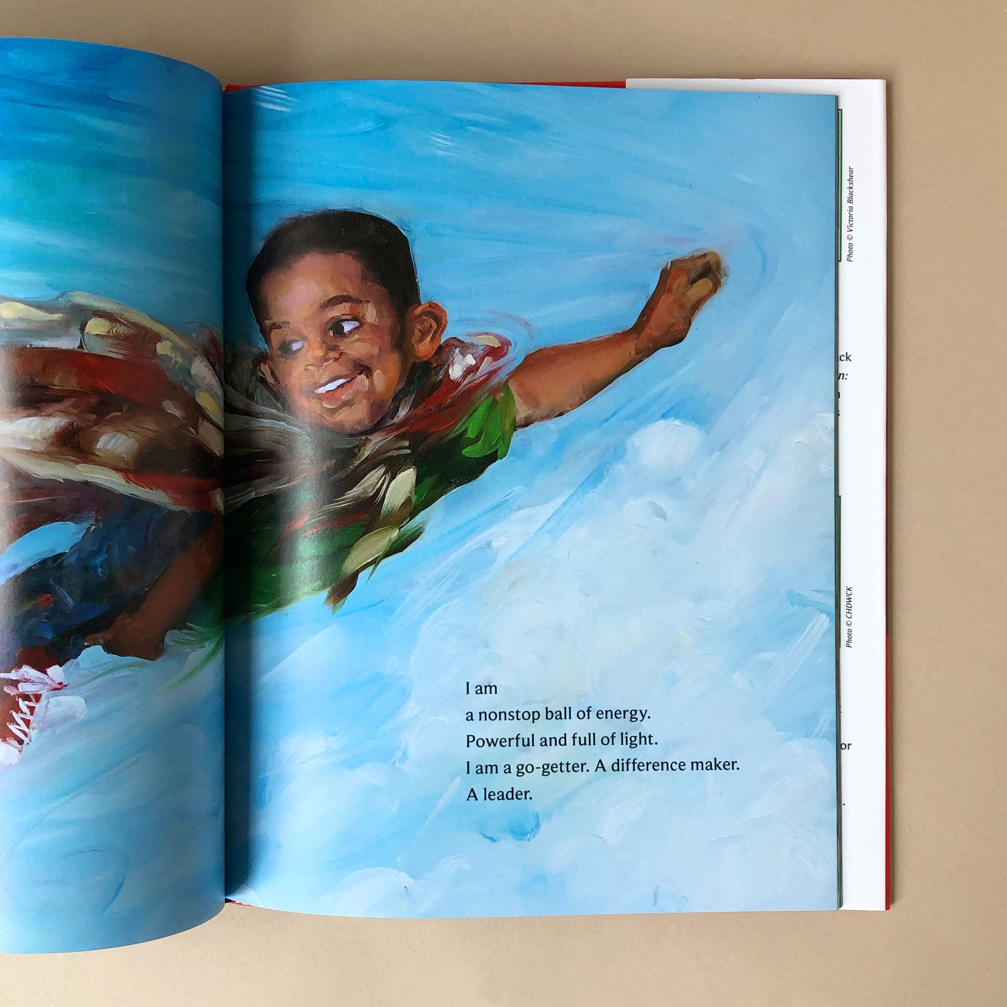 i-am-every-good-thing-book-illustrations-of-litttle-boy-flying-with-cape-in-the-sky-by-derrick-barnes-and-gordon-c-james