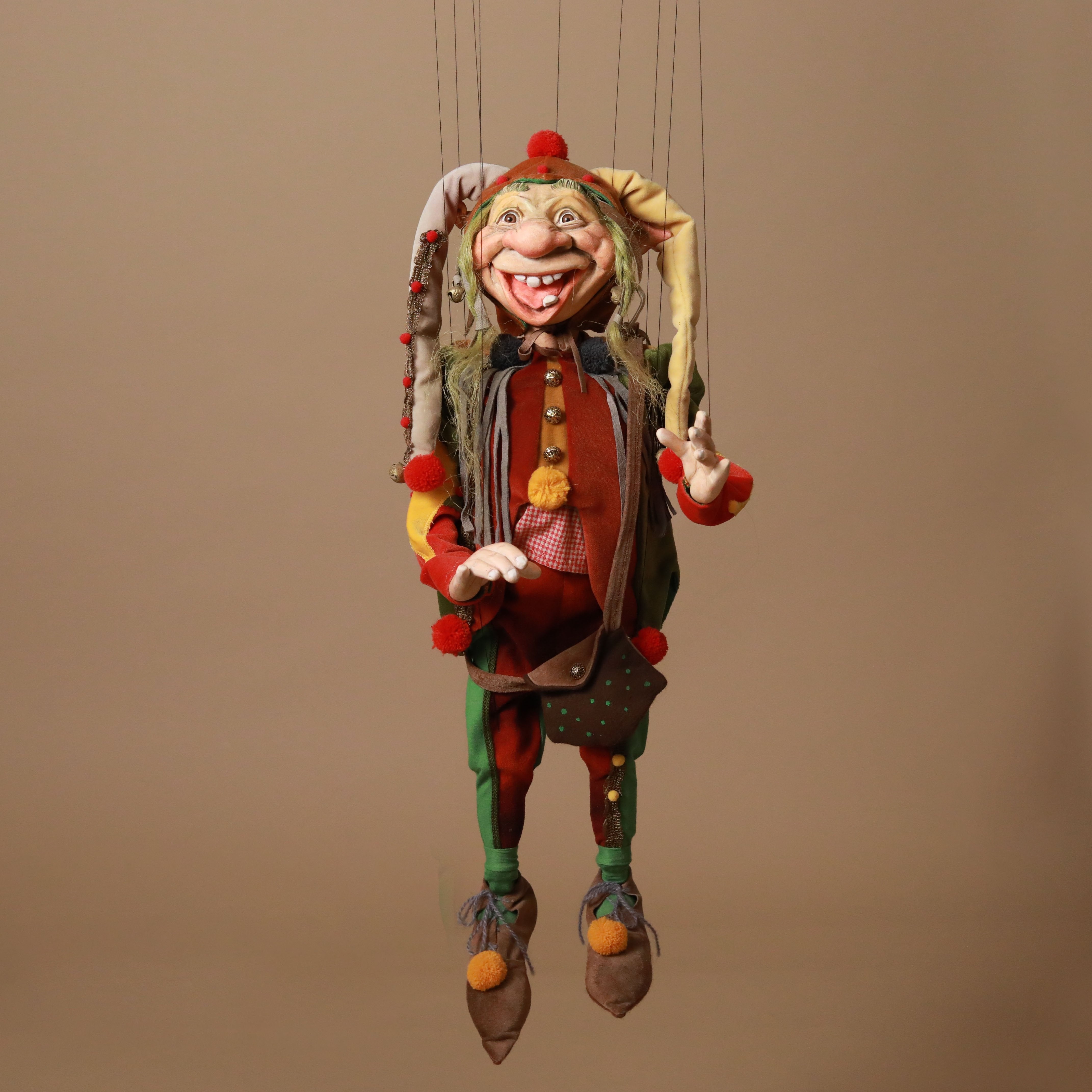 colorful-jester-marionette-long-hat-pom-poms-tongue-sticking-out