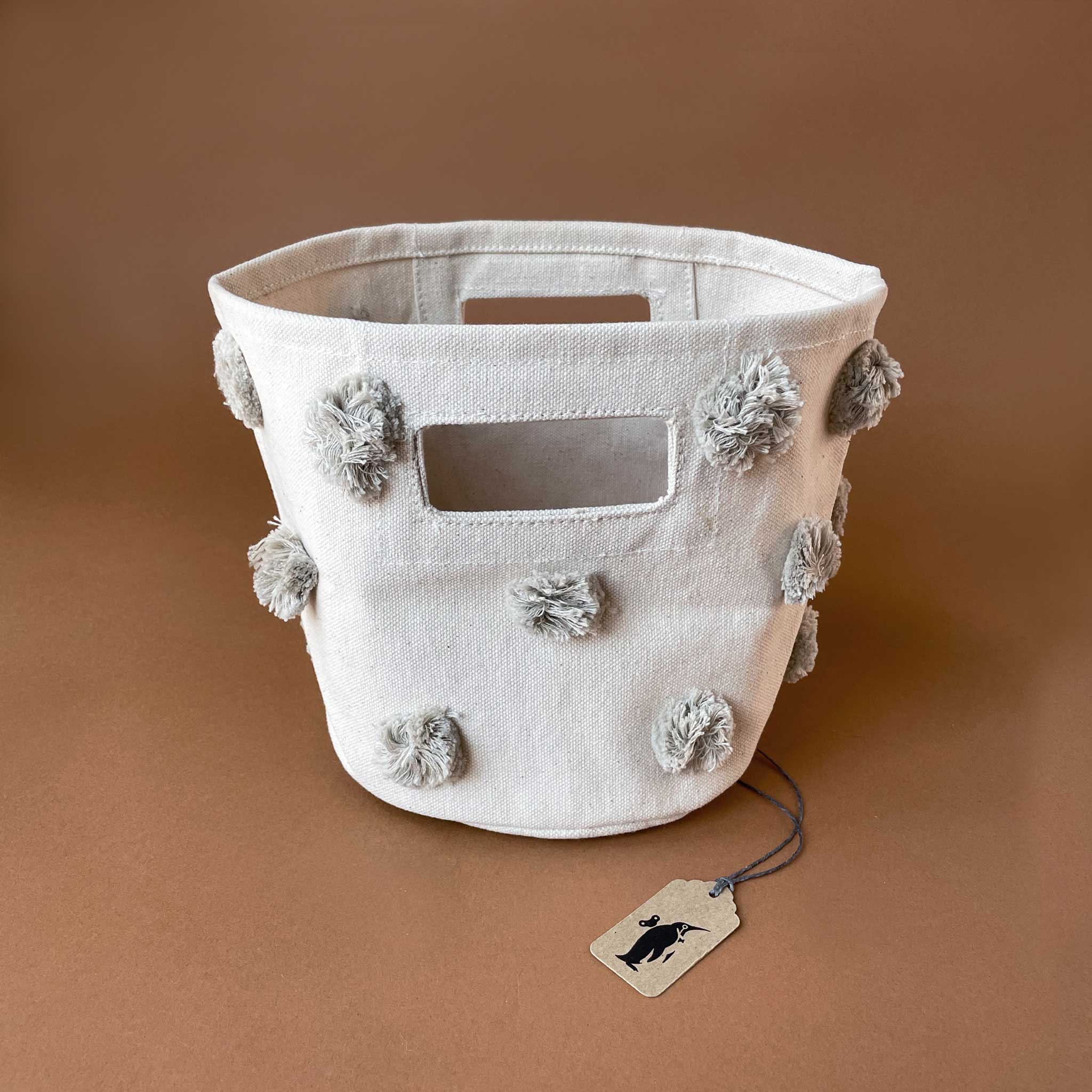 canvas-storage-bin-with-grey-pom-poms