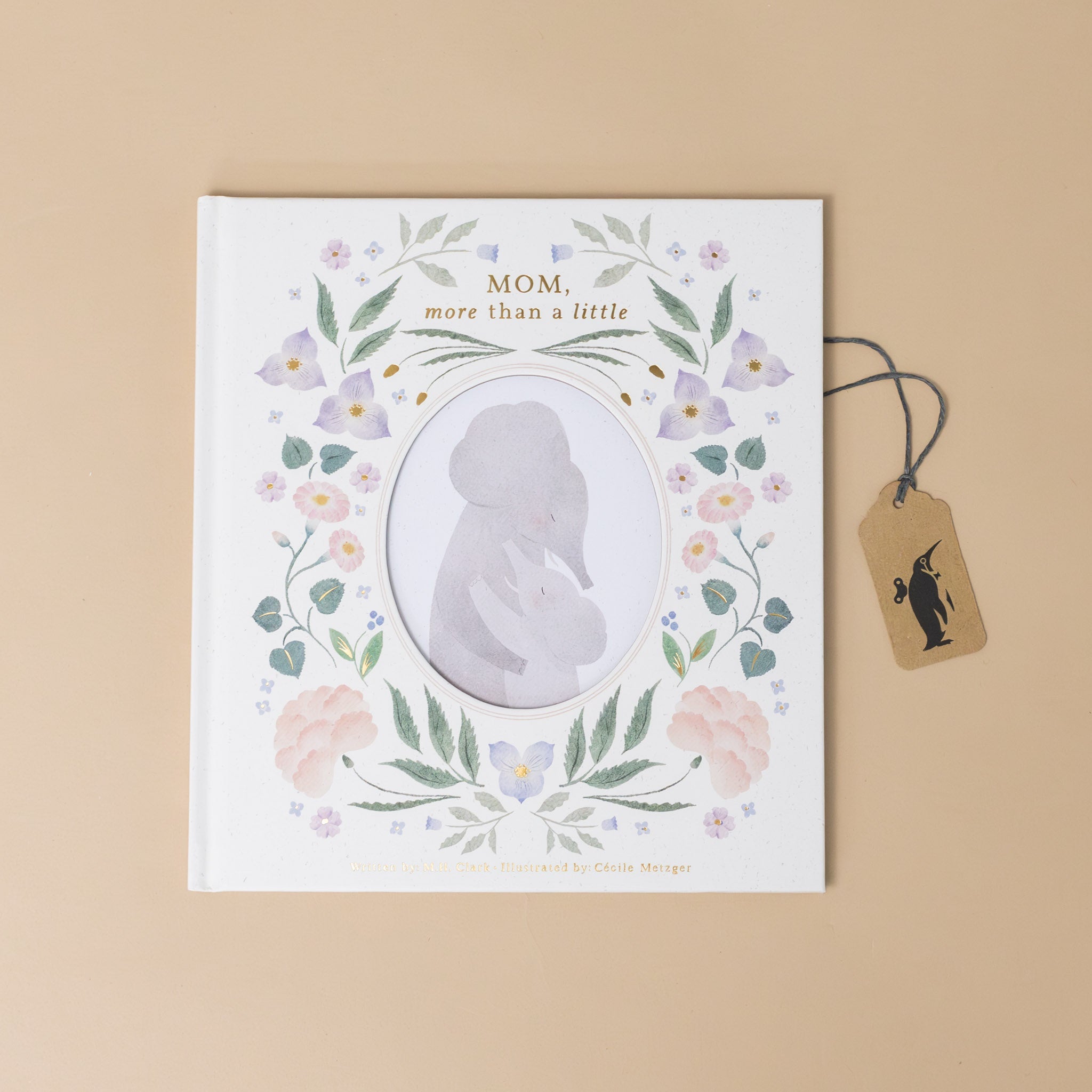 mom-more-than-a-little-book-cover-with-floral-vines-outlining-mom-and-child-hugging