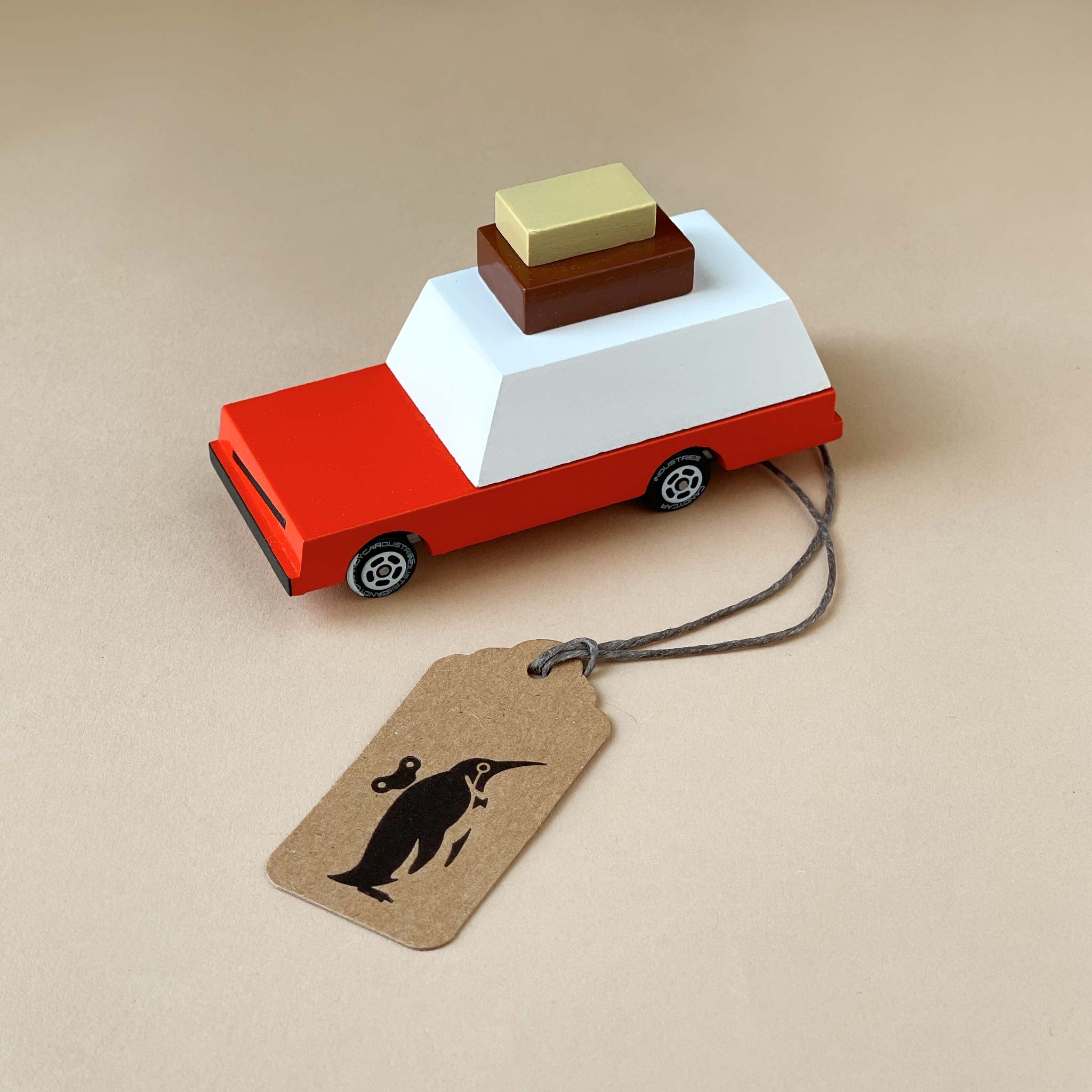 orange-car-with-luggage-blocks-on-top