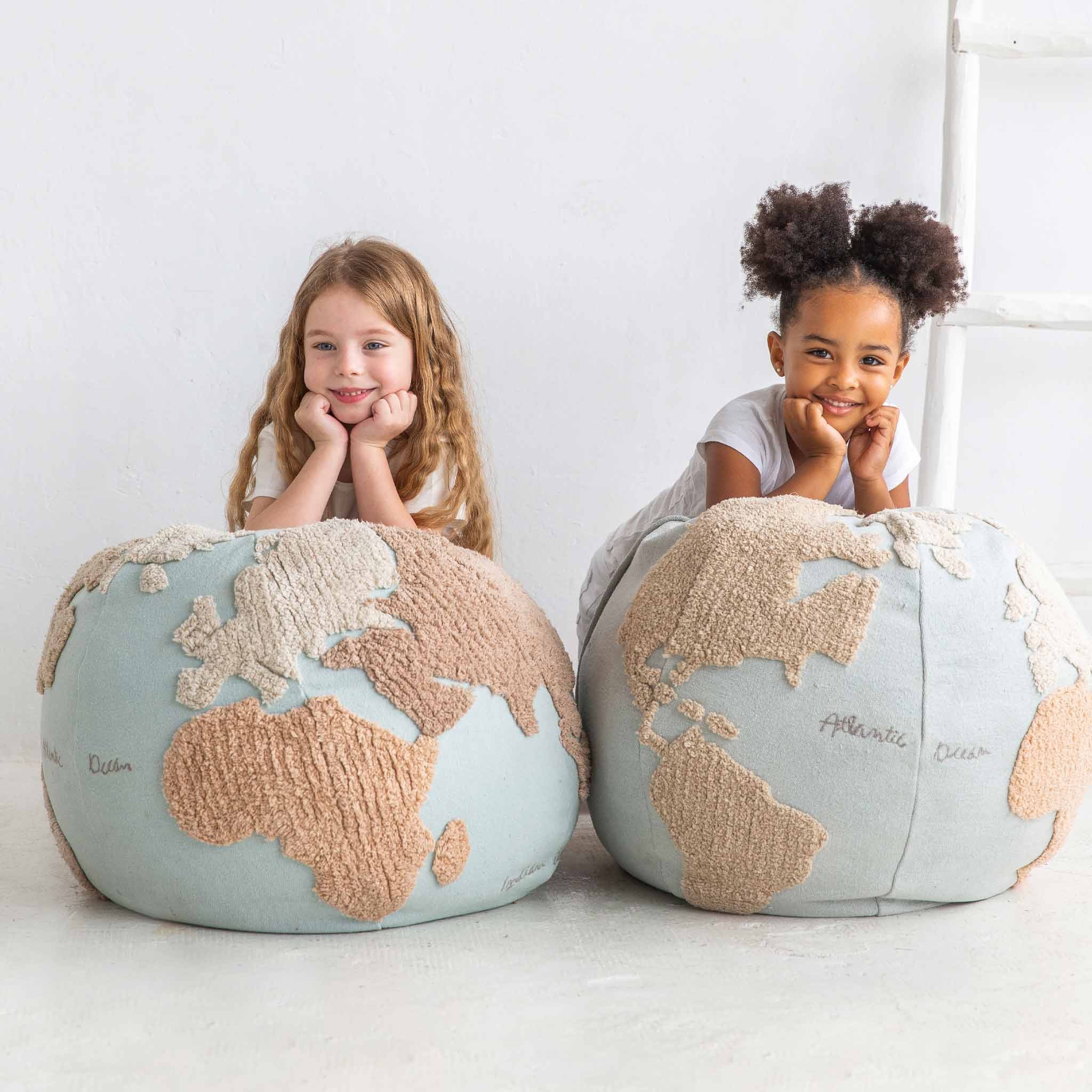 large-world-map-pouf-cushion-with-two-girls-leaning-on-them